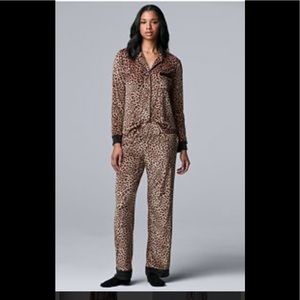 Two Piece Pajama Set.  Long bottoms and button up top.  NWT. Very soft.